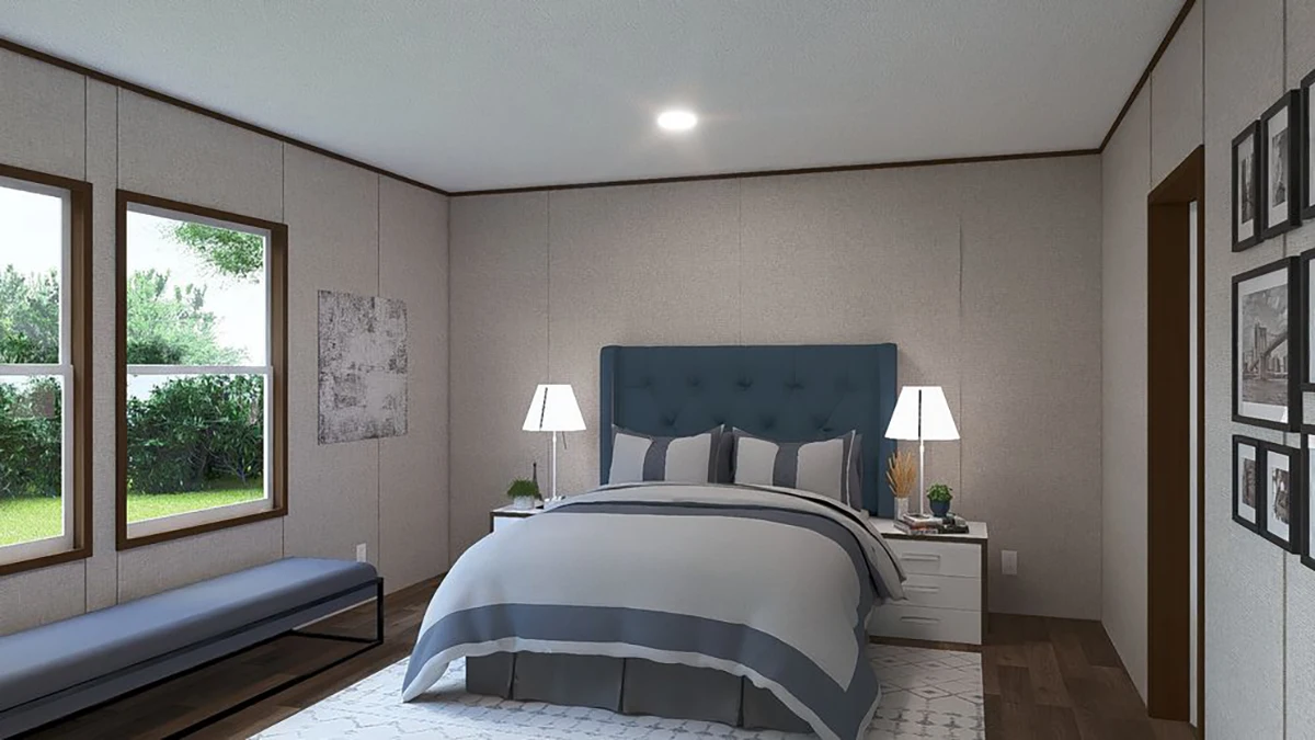 380537f6-3b47-40b4-8fae-e85192ba043d A modern bedroom with a blue upholstered bed, two bedside tables with lamps, a bench by the windows, and framed pictures on the wall.