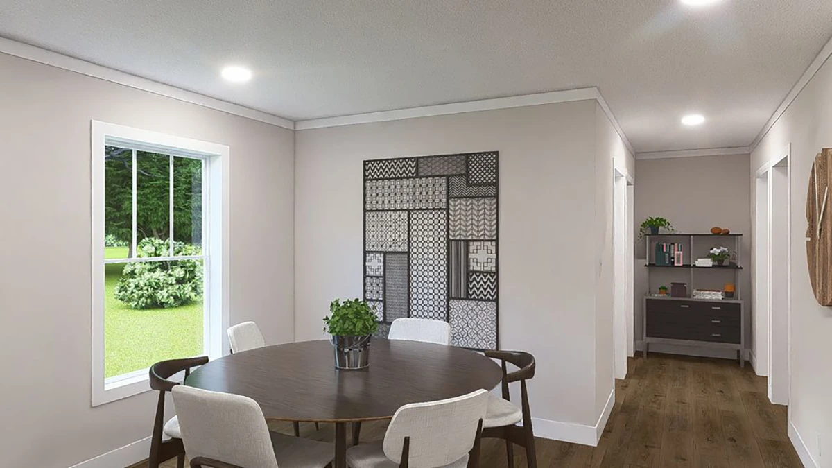 385ca7c4-6191-4c7a-b6f6-0791882e6cc2 A dining area with a round table and four chairs, a plant centerpiece, wall art, a window showing greenery, and a sideboard with shelves in the back.