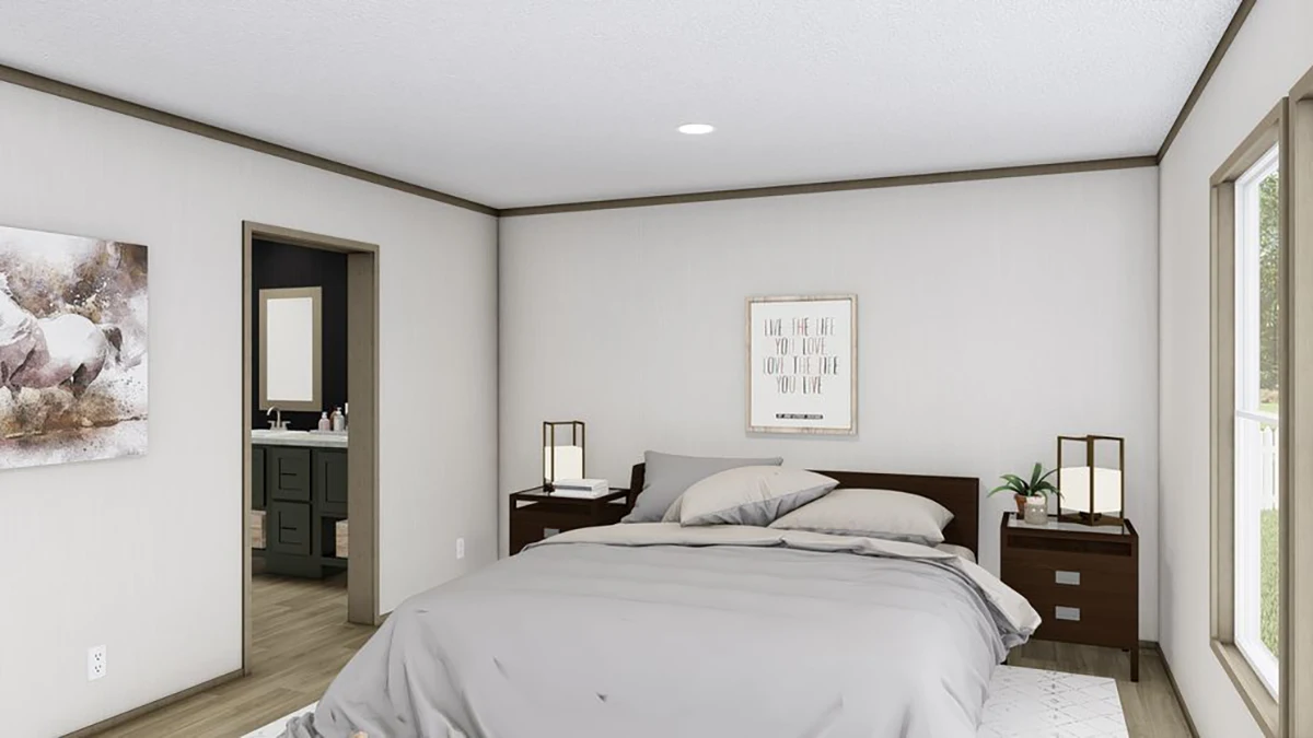 A modern bedroom with a neatly made bed, two nightstands with lamps, a large window, and a doorway leading to a bathroom.