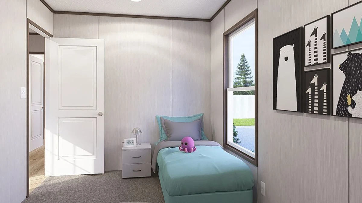 A small bedroom with a single bed, teal bedding, a plush toy, a nightstand with a clock, and framed animal art on the wall beside a window showing a yard.