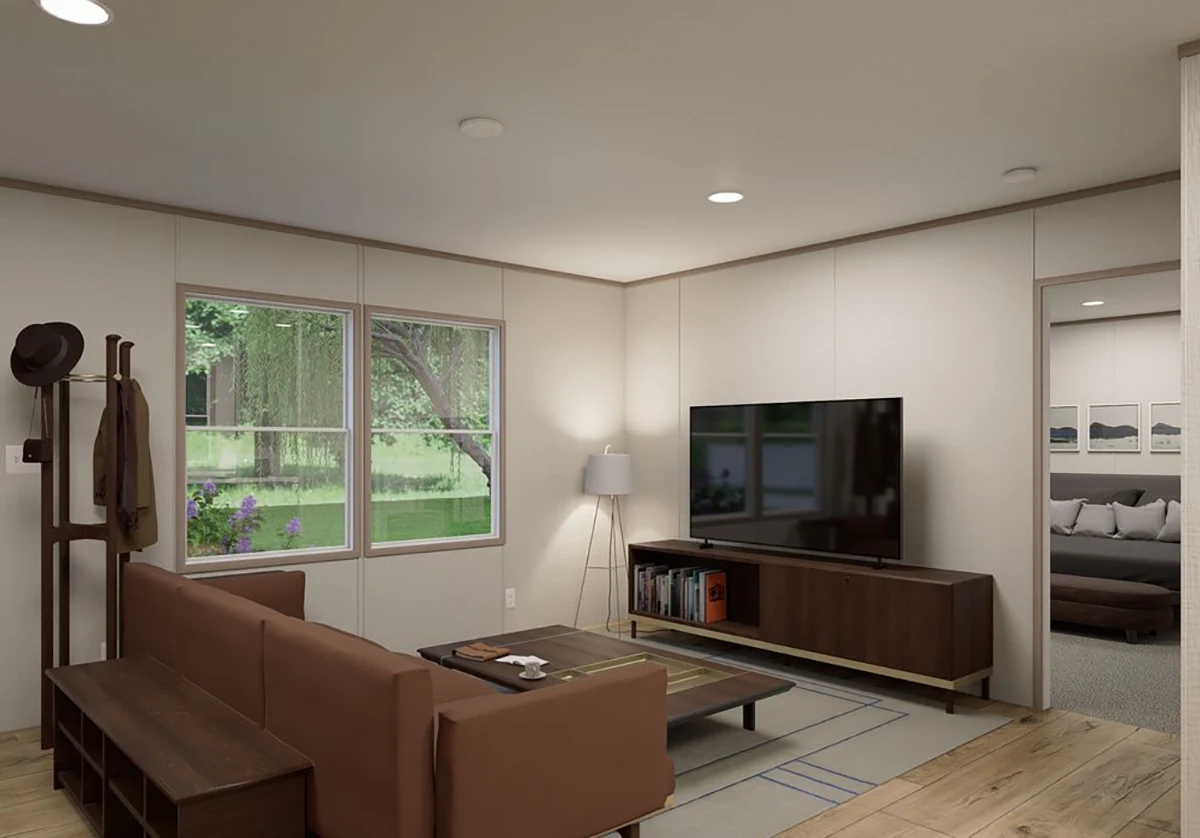 4495dd77-a07b-4235-a4a3-bc7bc3dd0638 Modern living room with a brown sofa, coffee table, TV on a stand, coat rack, and large window showing greenery outside; bedroom visible through an open doorway.