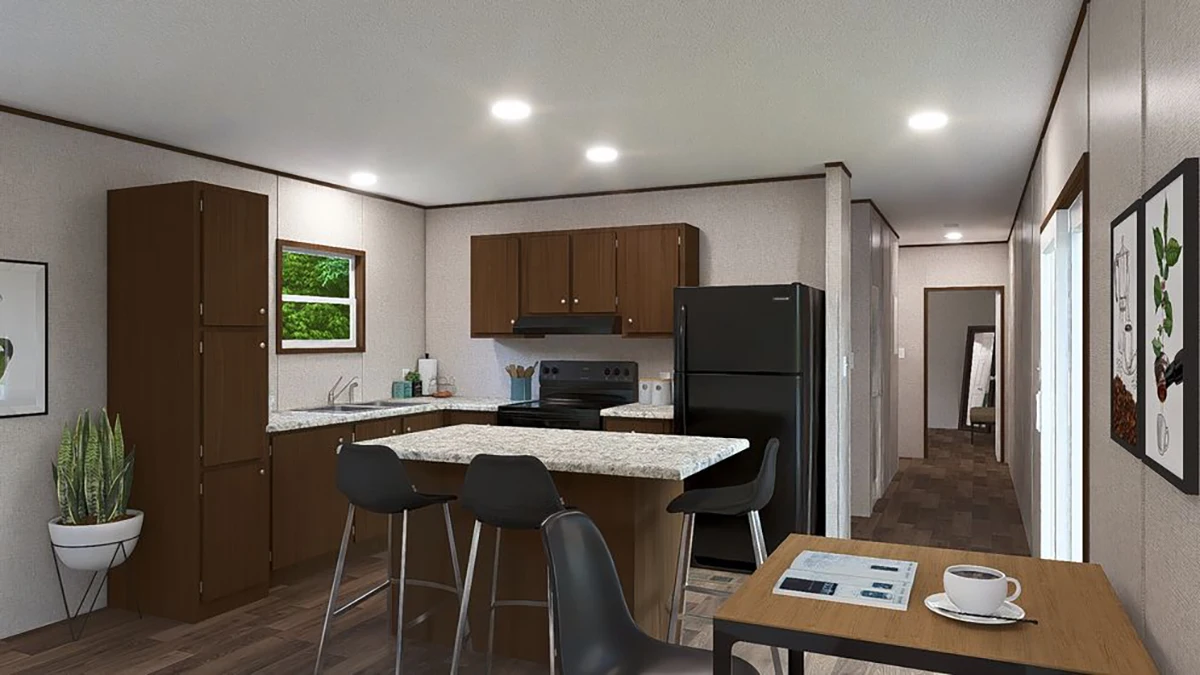 Modern kitchen with brown cabinets, a black fridge, and an island with barstools; small dining table and potted plant visible; hallway leads to other rooms.