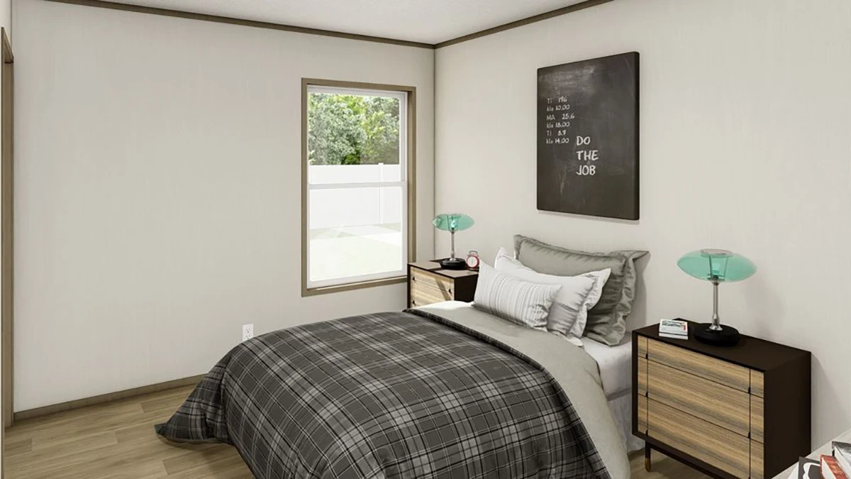 A small bedroom with a neatly made bed, two nightstands with lamps, a window, and a black sign on the wall that says “Do the job.”.
