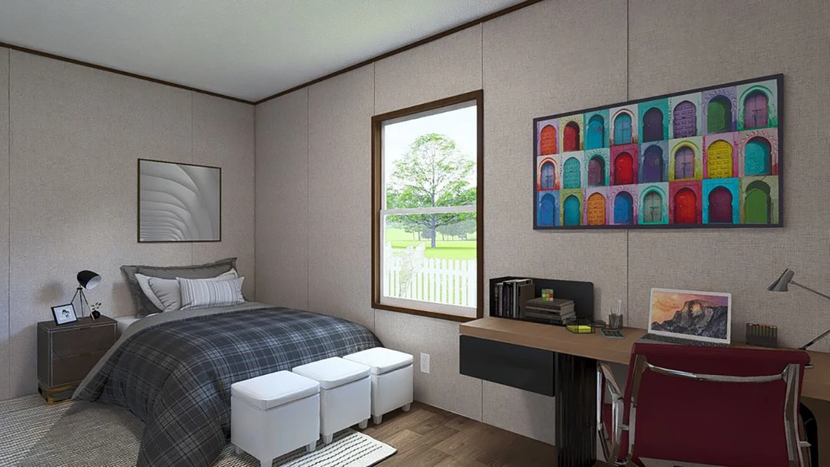 A bedroom with a single bed, nightstand, desk, chair, bookshelf, and window; colorful artwork and a laptop are on the desk, and three white ottomans are at the bed’s foot.