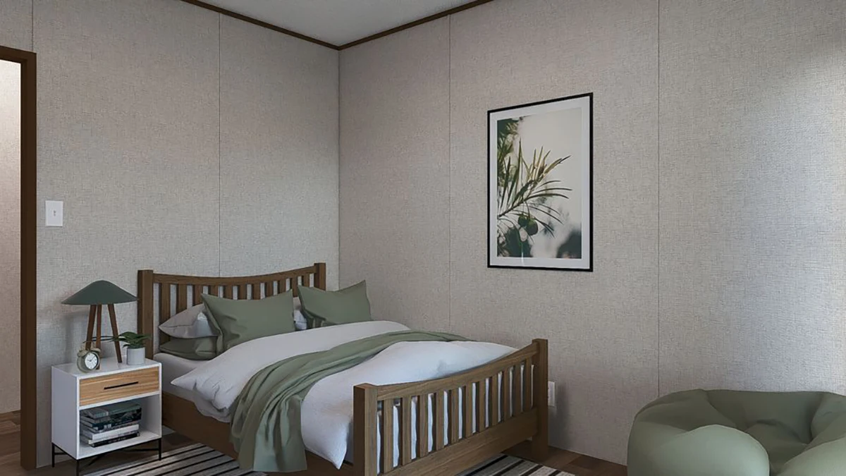 56455bbc-9dc8-46e4-87da-d694396d4190 A neatly made bed with green and white bedding, a nightstand with a lamp and books, a bean bag chair, and a framed botanical print on the wall in a simple bedroom.