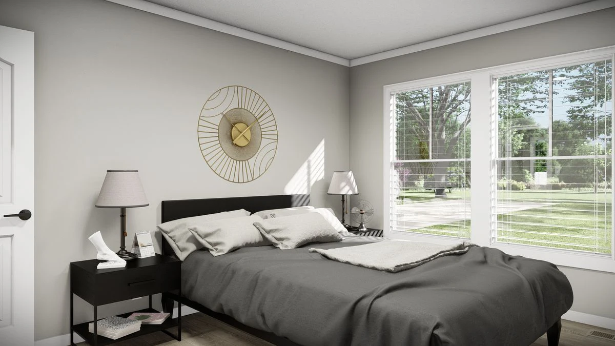597d9052-f927-49b6-b3c3-0ebea52886f9 A modern bedroom with a made bed, gray bedding, two black nightstands with lamps, wall art above the headboard, and large windows letting in natural light.