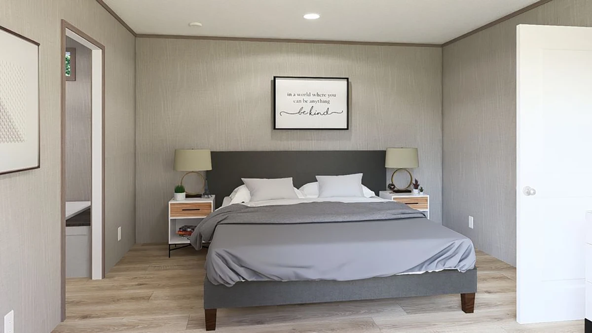5f4fb031-acd8-4361-9166-21b9605784d2 Modern bedroom with a gray upholstered bed, two nightstands with lamps, light wood flooring, and a framed quote on the wall above the headboard.