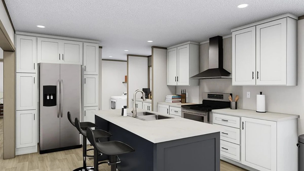 Modern kitchen with white cabinets, stainless steel appliances, a dark island with a sink, three barstools, and light wood flooring; laundry area visible in the background.