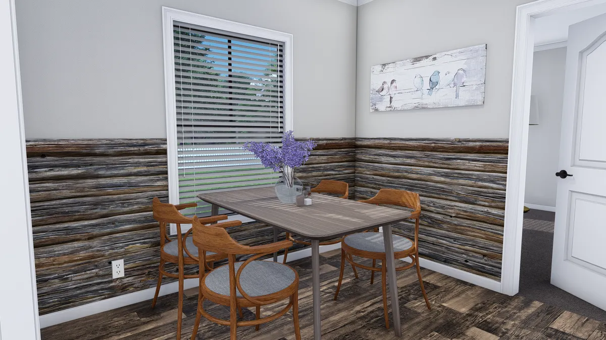 690e5ab5-fe44-4bd4-9ace-3853cffb7170 A small dining area with a wooden table, four chairs, a vase of purple flowers, wood panel walls, window blinds, and a bird painting on a light-colored wall.