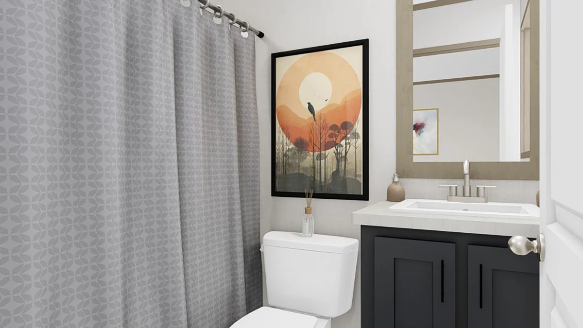 6c2bbc1b-4fe3-4999-8992-cc9d311a8552 A modern bathroom with a patterned gray shower curtain, white toilet, black vanity, and a framed sunset artwork above the toilet.
