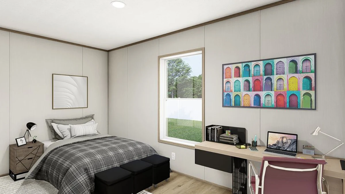 6cc2f033-f946-4156-baea-993c92d47a4f A modern bedroom with a bed, nightstand, desk, laptop, and colorful artwork on the wall. A window lets in natural light and offers a view of grass and trees outside.