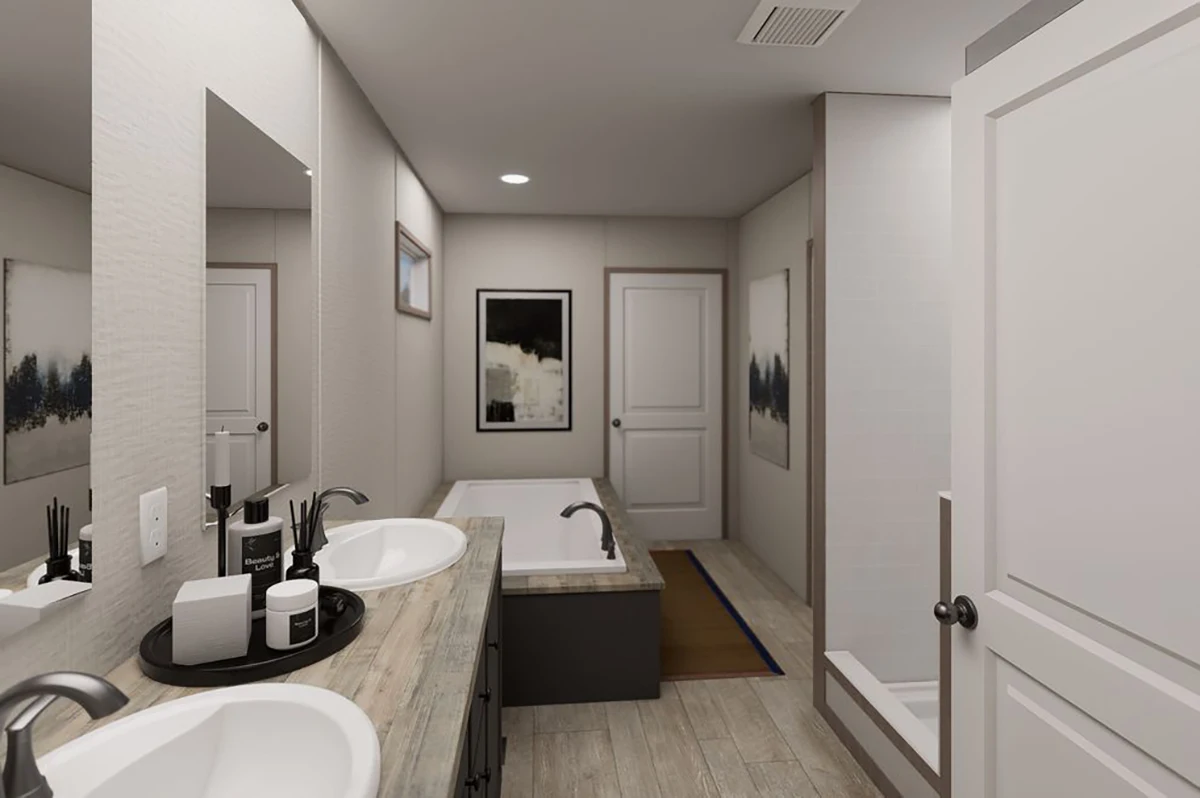 Modern bathroom with double sinks, a rectangular bathtub, a separate shower, and neutral-toned decor. There are framed artworks and various toiletries on the counter.