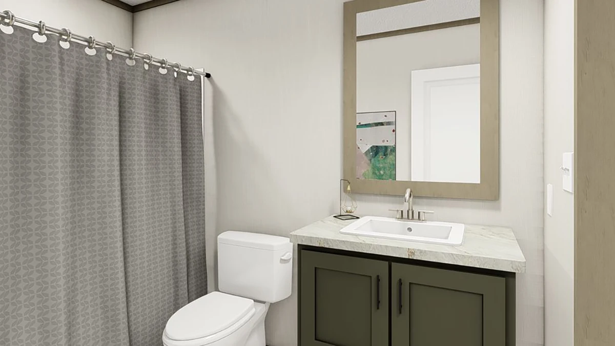 Modern bathroom with a gray patterned shower curtain, white toilet, dark green vanity with a marble countertop, sink, and a large rectangular mirror above.