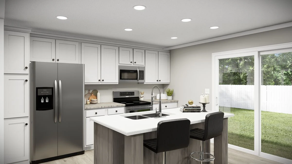 7b68abbb-8c2a-412f-9c40-e7ac09174449 Modern kitchen with white cabinets, stainless steel appliances, an island with a sink and two black barstools, and sliding glass doors leading to a fenced backyard.
