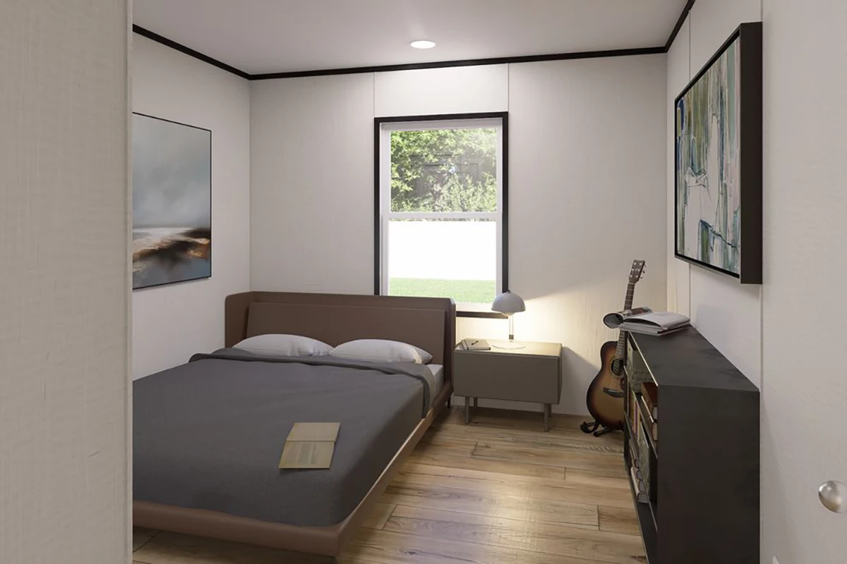 7dface12-34d5-4252-8a3f-e4e7972737ce A small bedroom with a bed, nightstand, lamp, bookshelf, guitar, and two paintings on the wall. A window shows greenery outside.