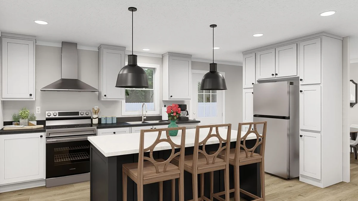 Modern kitchen with white cabinets, stainless steel appliances, a central island with wooden chairs, black pendant lights, and a vase with red flowers on the countertop.