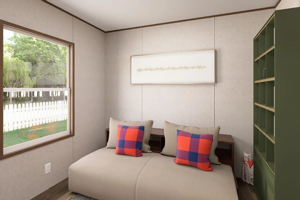 8897e07b-48a3-4f88-a4bc-623a0bfa3dd4 Small bedroom with a window, beige walls, a low bed with two plaid pillows, a green shelving unit, and a framed artwork above the bed.