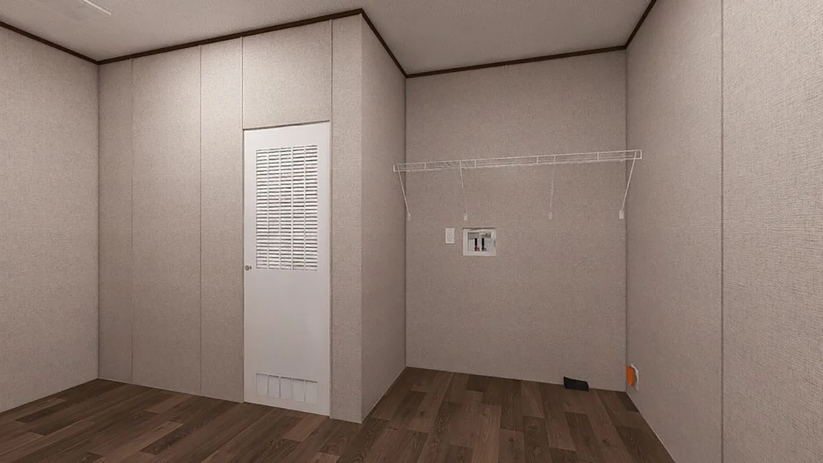 8cbd5df6-93cc-43f1-bc1a-895ccae66ae9 Empty room with beige walls, a white louvered door, wire shelf, electrical outlet, and dark wood flooring.