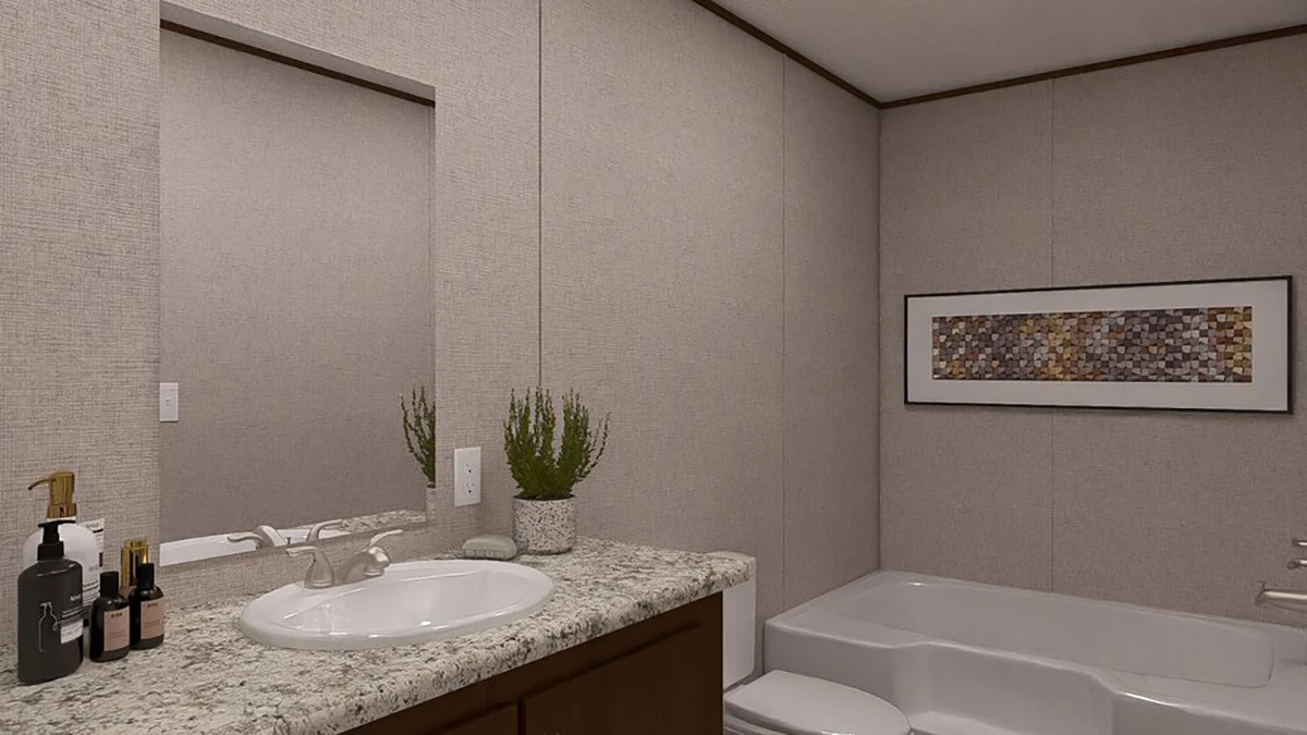 8ff76e6e-864e-4ed2-973d-f5b1d57aef89 Modern bathroom with a sink, countertop, soap dispensers, potted plant, bathtub, and a framed mosaic artwork on the wall.