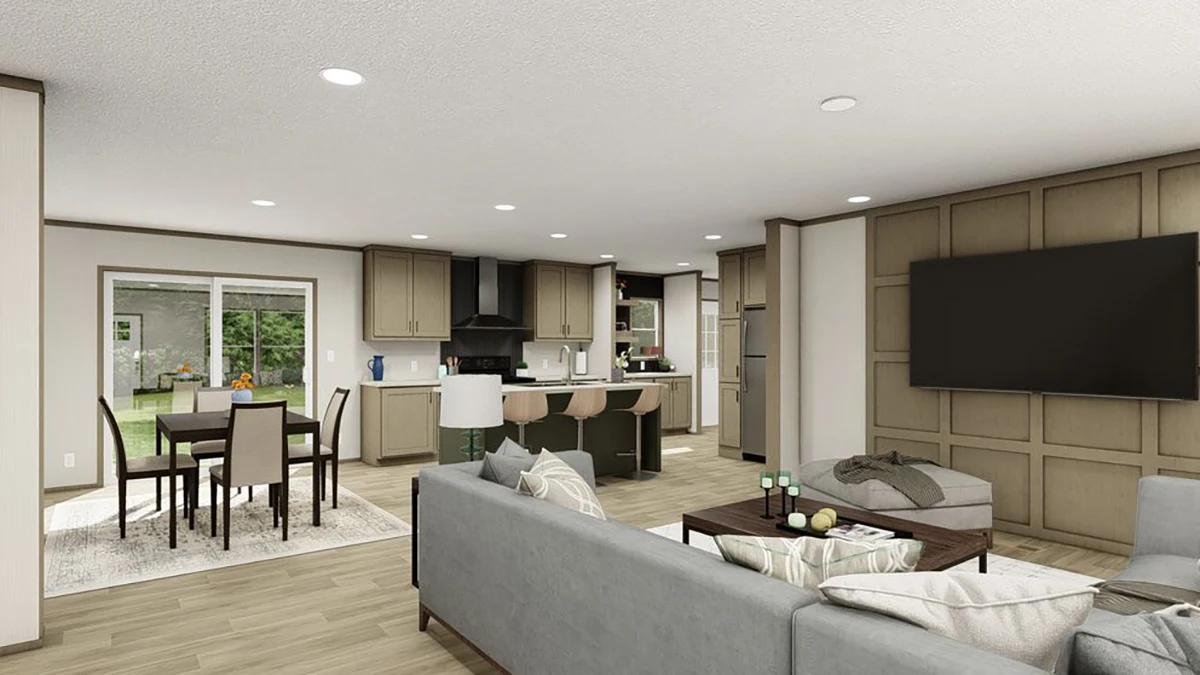 Open-concept living, dining, and kitchen area with modern furnishings, island seating, large TV, and sliding glass doors leading to a backyard.