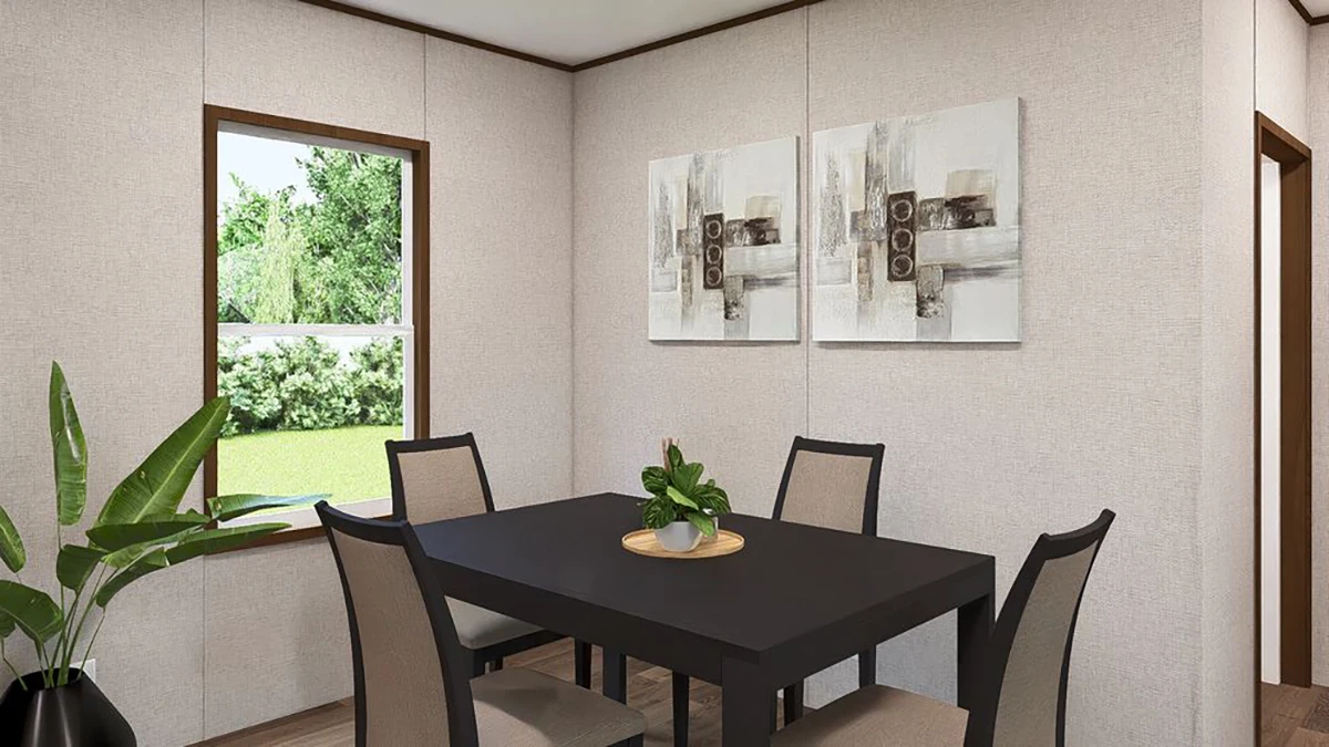 A small dining room with a black rectangular table, four chairs, a potted plant centerpiece, wall art, and a window showing greenery outside.