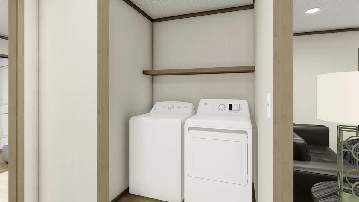 Washer and dryer set in a recessed laundry nook with a wooden shelf above, adjacent to a living room area.