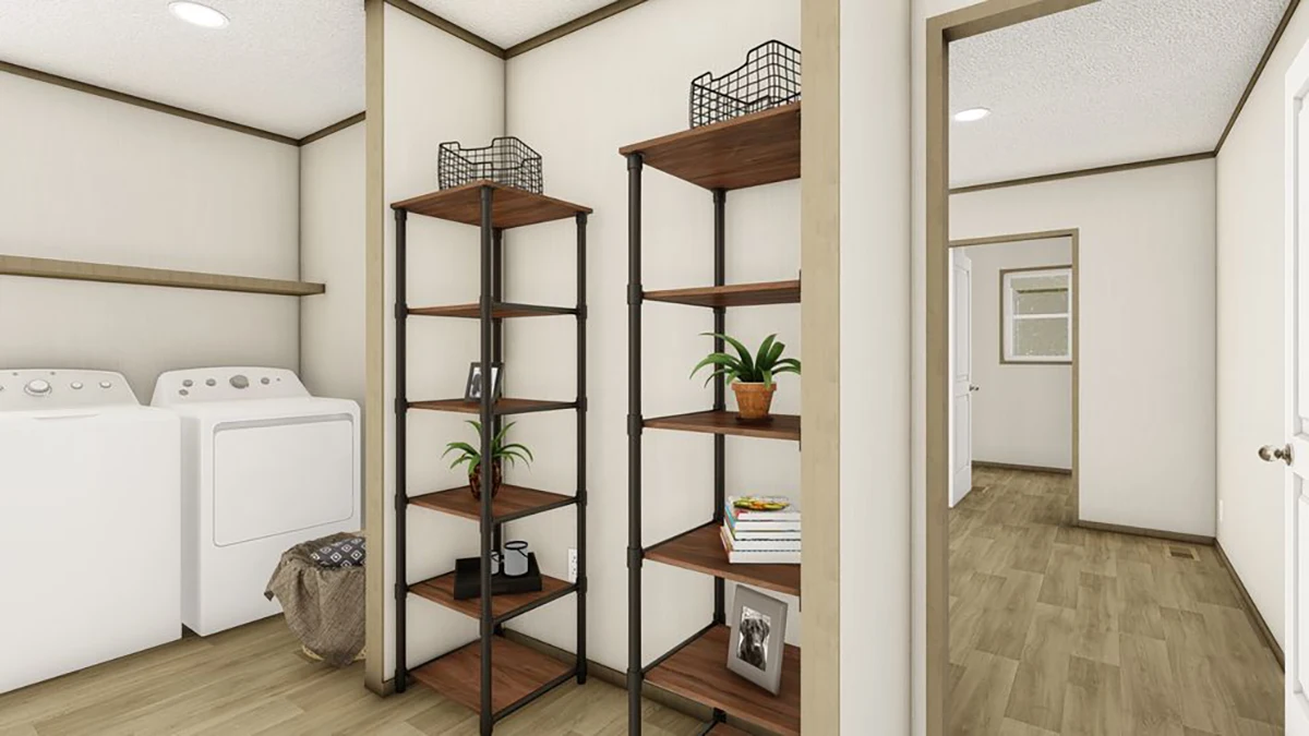 A laundry room with a washer, dryer, two tall shelving units holding plants and decor, a laundry basket, and wood-look flooring.