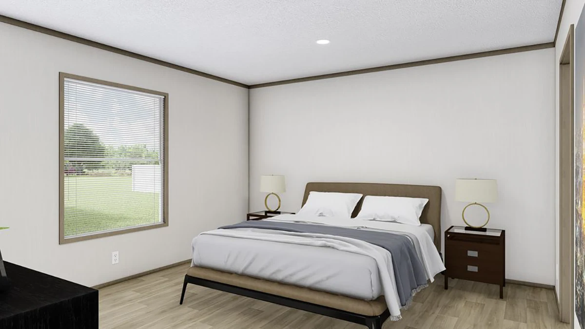 A bedroom with a double bed, two bedside tables with lamps, a window with blinds, and light-colored walls and flooring.