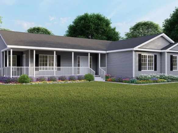 Single-story gray house with white trim, covered front porch, large windows, and landscaped flower beds on a well-kept lawn with trees in the background.