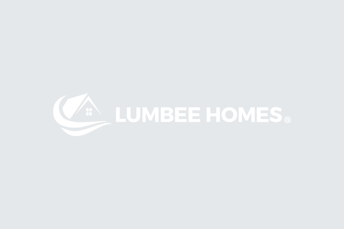 Property-Placeholder Lumbee Homes logo featuring a stylized house with a wave design next to the company name in bold uppercase letters on a light gray background.