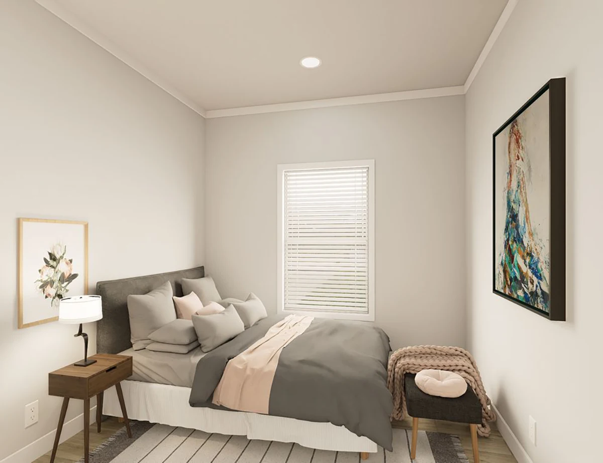 The Elite 52 22 Minimalist bedroom with a double bed, gray and beige bedding, two nightstands, artwork on the walls, a small bench with a blanket, and a window with closed blinds.