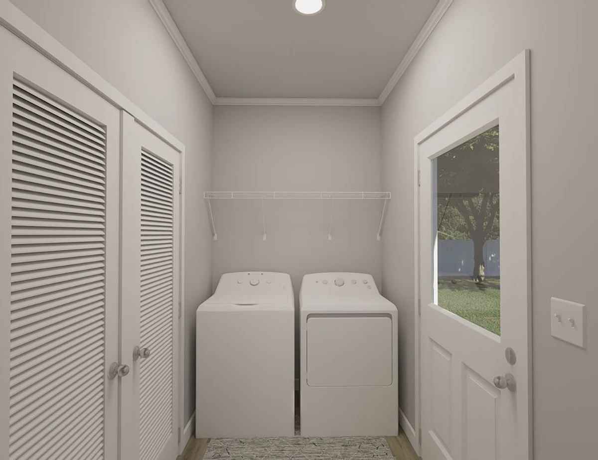 The Elite 52 5 A laundry room with a washing machine and dryer side by side, white walls, a shelf above the appliances, and a door with a window leading outside.