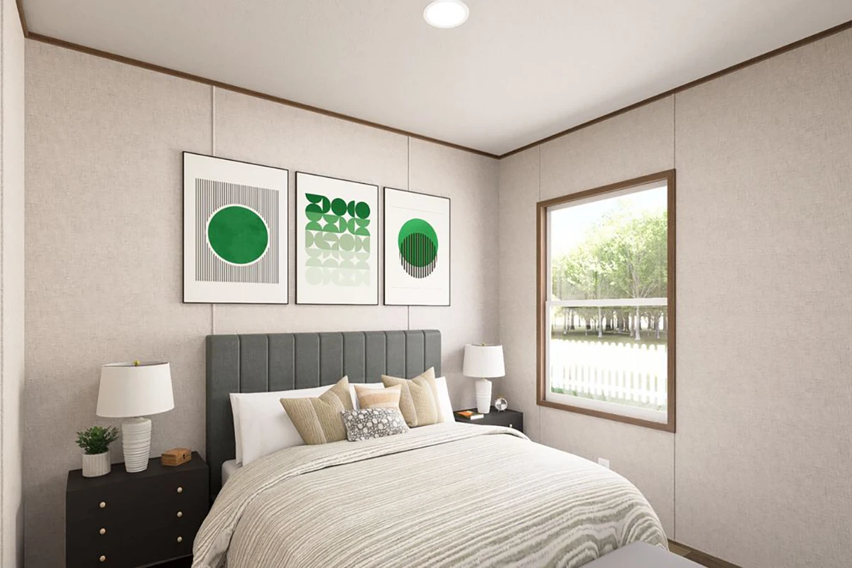a8ed5515-5cb1-40fa-934e-90e7c9b9c4f2 A modern bedroom with a neatly made bed, two bedside tables with lamps, three abstract green art pieces above the headboard, and a window showing trees outside.