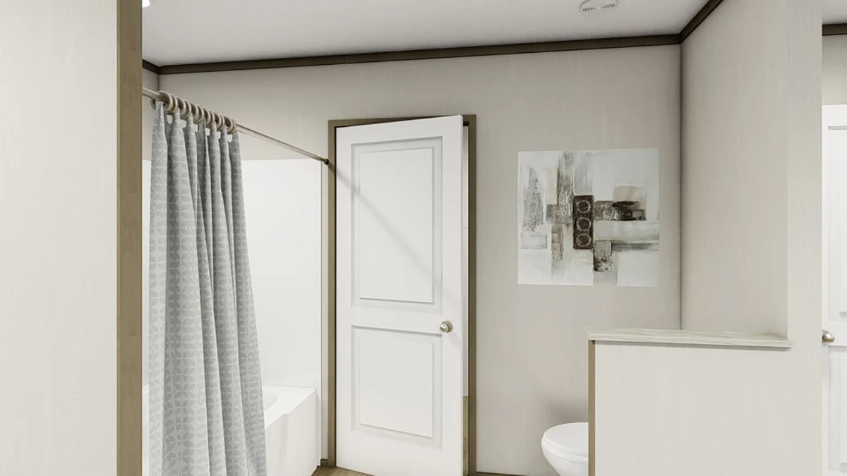 acd5a4e7-2cd8-4641-96ad-a967de0cf4c9 A bathroom with a shower and gray curtain, a white door, abstract wall art, and part of a toilet visible.