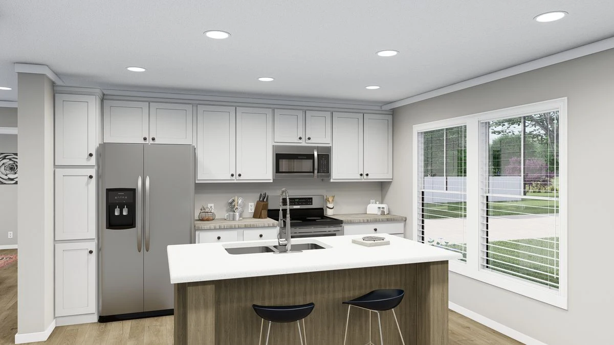 Modern kitchen with white cabinets, stainless steel appliances, island with sink and two barstools, and large window with a view of a green yard.