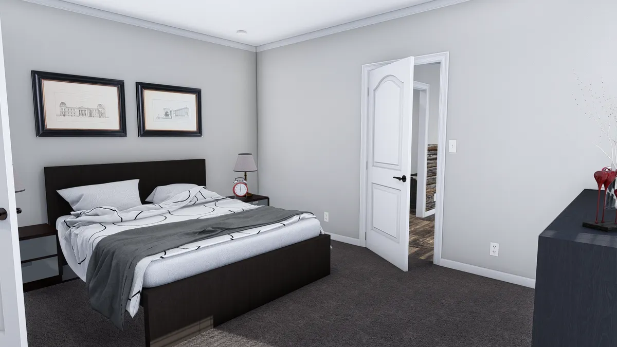 bc530c71-3dcb-4cdd-88db-8e727524a585 A modern bedroom with a double bed, two framed pictures above the headboard, a lamp and alarm clock on a nightstand, and an open door leading to a hallway.