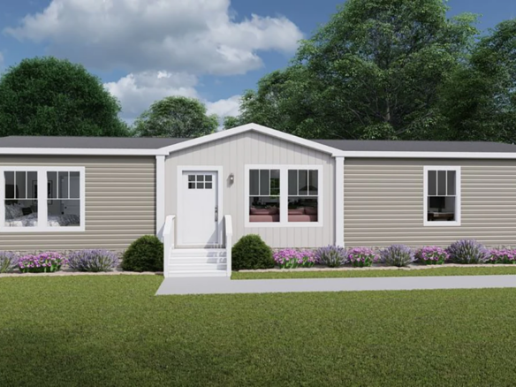 A beige manufactured home with white trim, three front windows, a central white door with steps, and landscaped bushes and flowers in front, set against green trees and a cloudy sky.