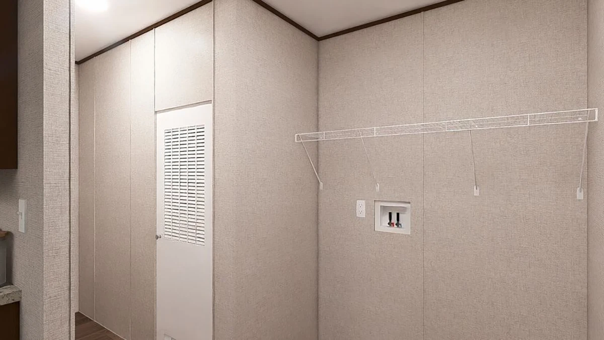 c965bdb5-e8ae-4543-aef9-863d973de5da Empty laundry room with beige walls, a vented door, a wire shelf, and hookups for a washer and dryer.