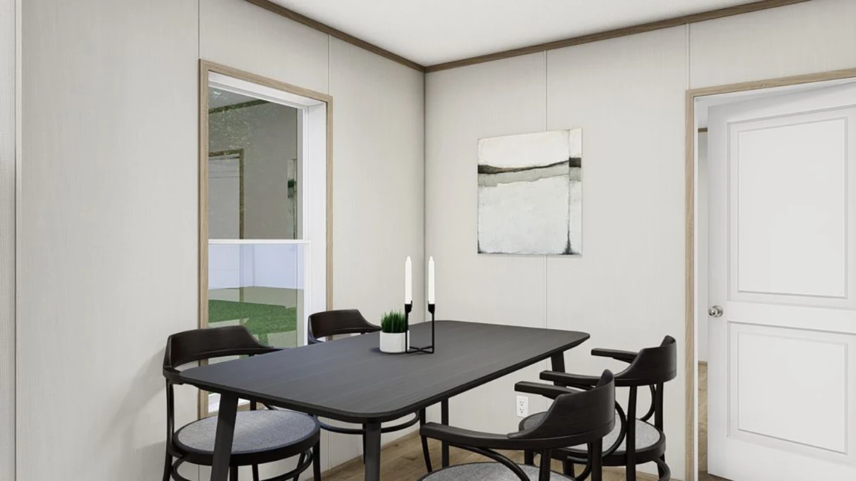 A modern dining room with a black table, four dark chairs, two candles, a small plant, and abstract art on the wall. A window and a door are visible.