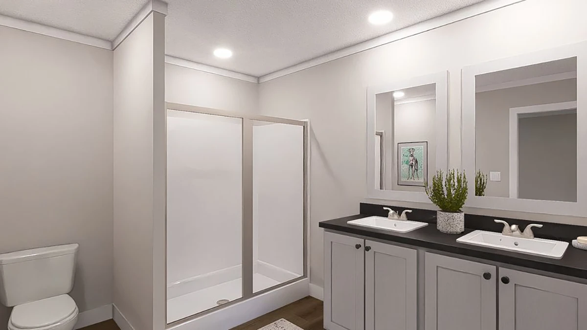 Modern bathroom with a glass shower, double sinks with mirrors, a toilet, and potted plant decor on a black countertop.