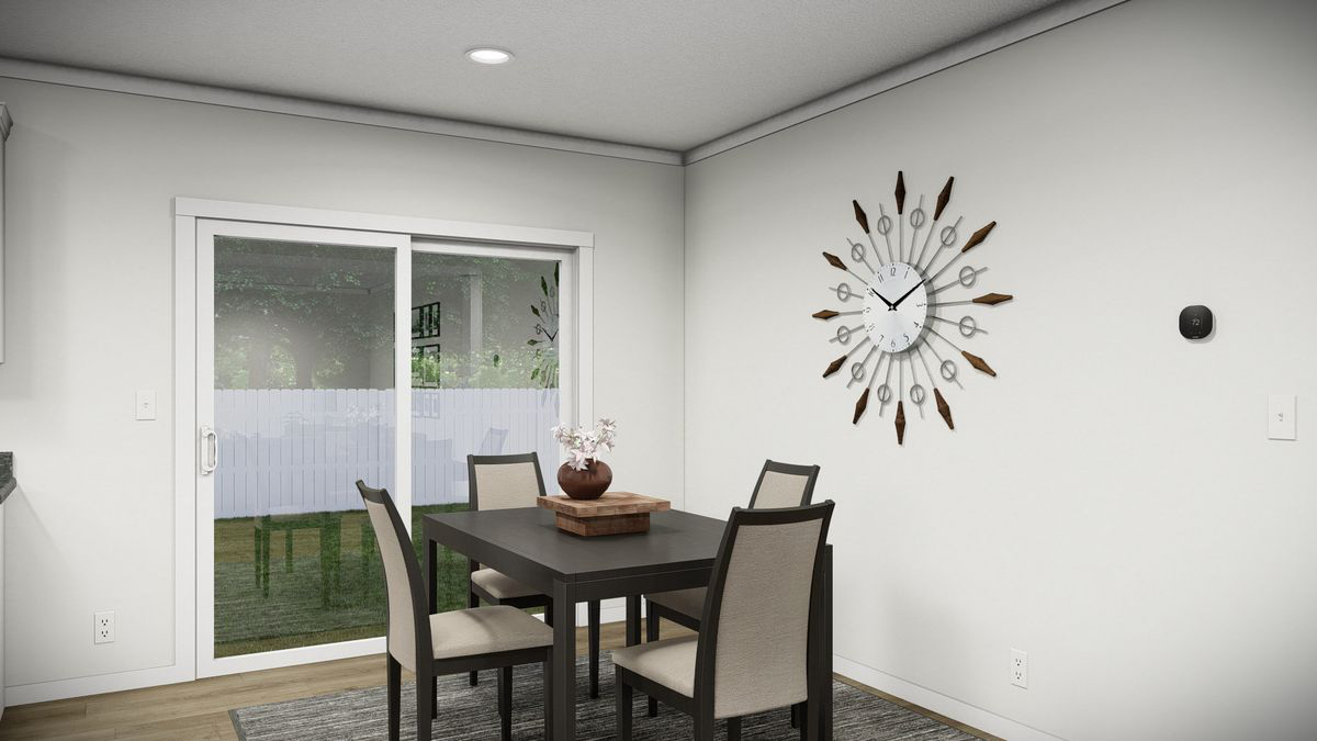 cd8b8cc0-cde6-4baa-8118-6c83ff2ae24b A modern dining area with a dark wood table, four chairs, a large decorative clock on the wall, and sliding glass doors leading to a fenced backyard.