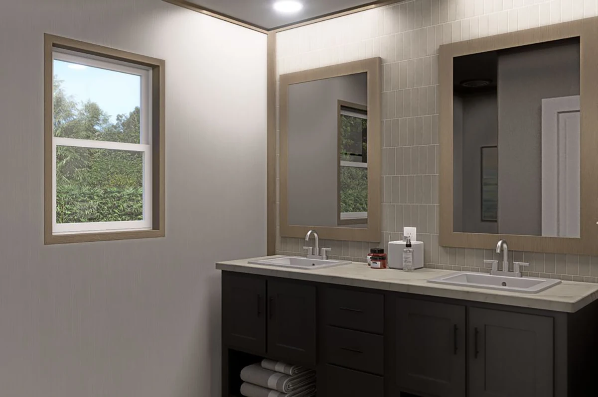 Modern bathroom with two sinks, mirrors above each sink, dark cabinets, towels on shelves, and a window letting in natural light.