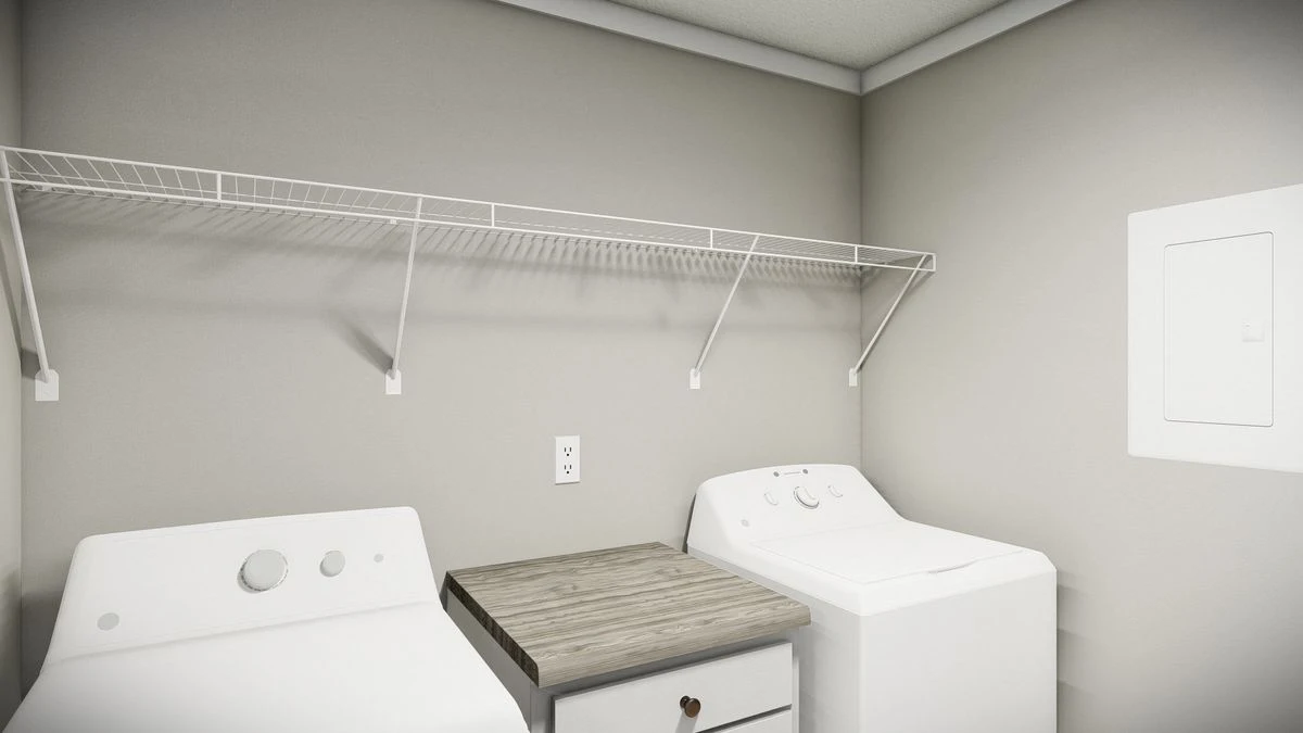 d077ae84-8047-46ca-b30d-53e55324e544 A laundry room with a white washer and dryer, a small wooden table in between, a wall-mounted wire shelf above, and a breaker box on the right wall.