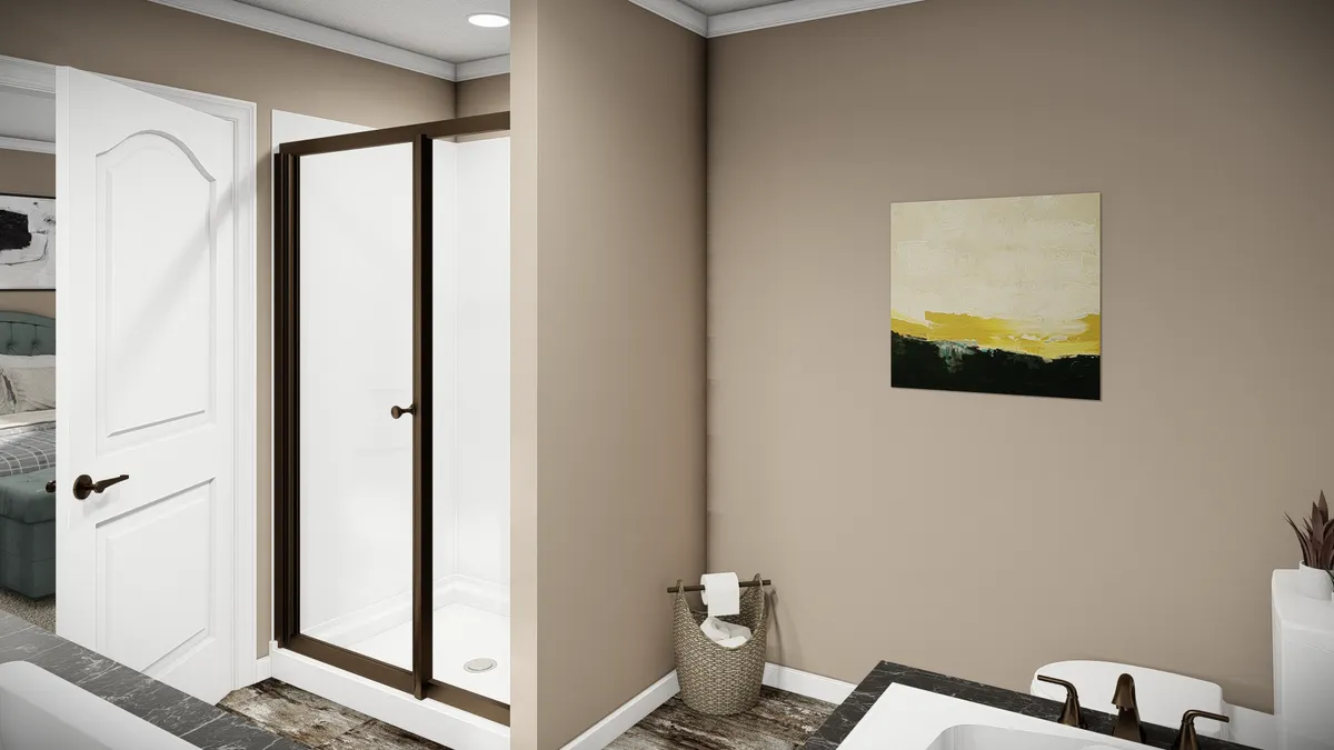 d0dff046-8d28-4b49-840a-a8041ee73cea A modern bathroom with a glass shower enclosure, beige walls, a painting, a toilet, and a wicker basket holding a towel and toilet paper.