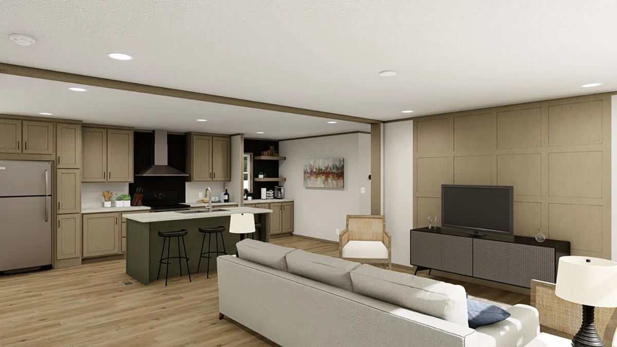 Modern open-plan living room and kitchen with beige cabinets, an island with two barstools, a sofa, TV, and wood flooring.