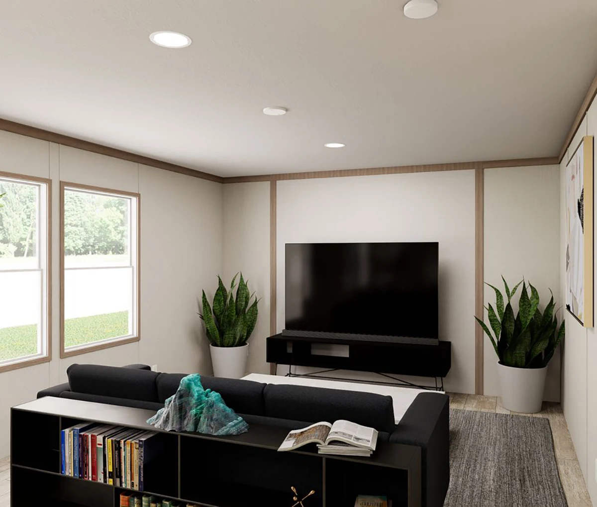 A modern living room with a black sofa, a flat-screen TV on a stand, potted plants, a bookshelf, and large windows letting in natural light.