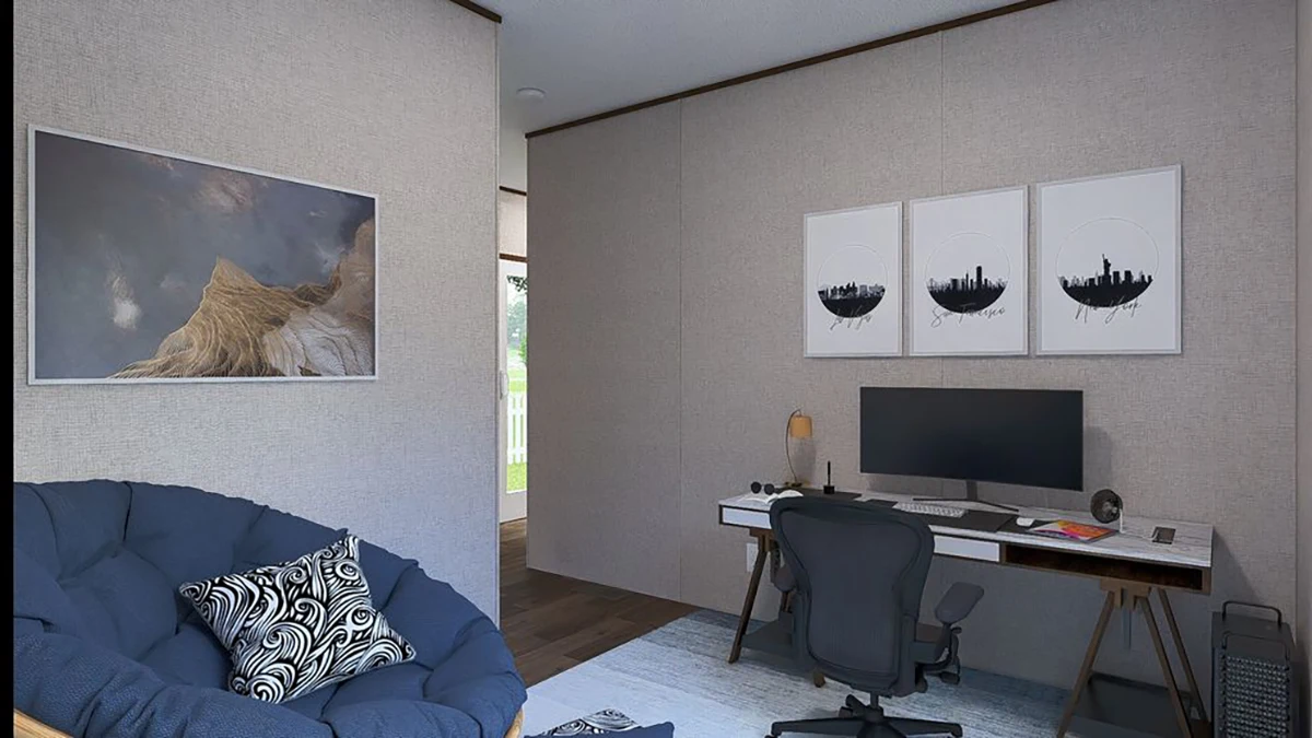 A modern home office with a desk, computer, chair, lamp, wall art, and a blue cushioned papasan chair with a patterned pillow.