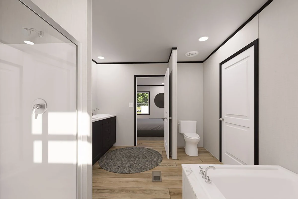 e0215bcd-af63-40ea-a7a1-abb9dd1a5048 Modern bathroom with a glass shower, bathtub, toilet, double-sink vanity, round rug, wood floor, and a view into a bedroom through an open door.