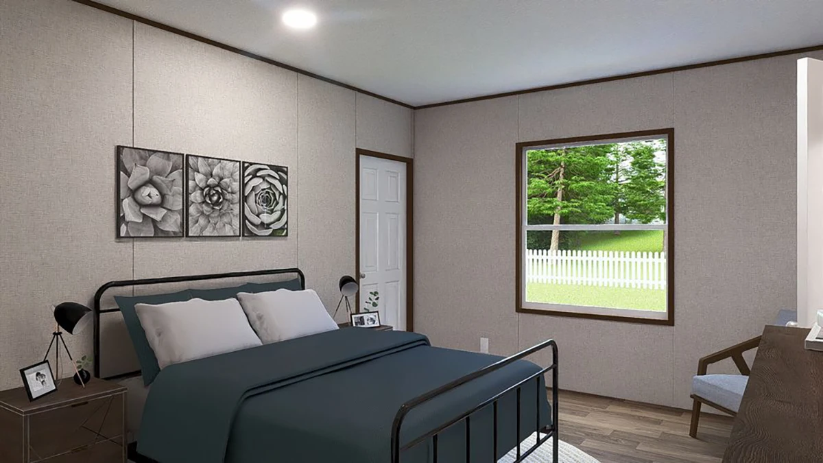 e34d7a62-01bd-4d5d-906e-b3b0bfb3875f A bedroom with a dark metal bed frame, blue bedding, nightstands with lamps, wall art above the bed, a window showing a green yard, and a wooden chair by a desk.