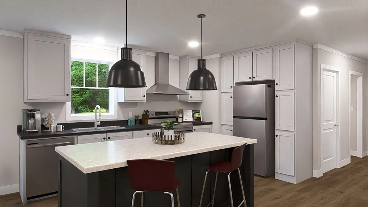 Modern kitchen with white cabinets, stainless steel appliances, center island with two chairs, pendant lights, and a window overlooking greenery.